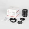 50mm F1.8 med autofokus prime objektiv. insiden av esken innhold i esken.